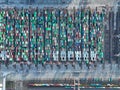 A top-down aerial drone photo showcases the intricate details of the Rotterdam container terminal, including ships