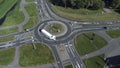 Top down aerial drone view of a small traffic roundabout