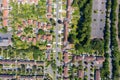 Top down aerial footage of the suburban houses and village of Welwyn Garden City in Hertfordshire taken on a hot sunny summers day