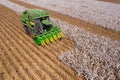 Aerial image of a Large Cotton picker harvesting a field.