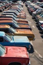 Top-down aerial perspective of a lineup of colorful classic cars, neatly parked in a row, exhibiting a palette of Royalty Free Stock Photo