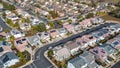 Top Down aerial photos over a community in California with homes with solar panels and roadways and parks