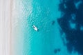top down aerial view of boat at Fteri Beach on the Greek island of Kefalonia, Ionian Sea Greece. Turquoise colored water Royalty Free Stock Photo