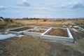 Top down aerial view of building works of new house concrete foundation on construction site Royalty Free Stock Photo