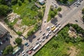 Top down aerial view of busy street intersection with moving cars traffic Royalty Free Stock Photo