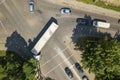 Top down aerial view of busy street intersection with moving cars traffic Royalty Free Stock Photo