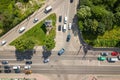 Top down aerial view of busy street intersection with moving cars traffic Royalty Free Stock Photo