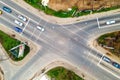 Top down aerial view of busy street intersection with moving cars traffic Royalty Free Stock Photo