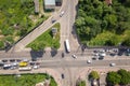 Top down aerial view of busy street intersection with moving cars traffic Royalty Free Stock Photo