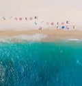 Top-down aerial view of a clean white sandy beach on the shores of a beautiful turquoise sea Royalty Free Stock Photo