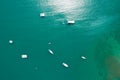 Top down Aerial view drone camera of Beautiful turquoise clear water sea with sailing boats in summer sea Tropical Phuket island Royalty Free Stock Photo