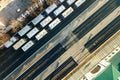 Top down aerial view of many cargo train cars on railway tracks Royalty Free Stock Photo