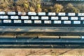 Top down aerial view of many cargo train cars on railway tracks Royalty Free Stock Photo