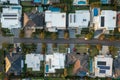 Top down aerial view of modern upmarket houses with pools and rooftop solar, Australia