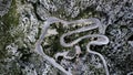 A top-down aerial view on mountainous curvy road Nus de Se Calobra