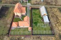 Top down aerial view of a private house with red tiled roof and frame structure prepared for installation of solar panels Royalty Free Stock Photo