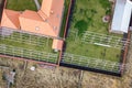 Top down aerial view of a private house with red tiled roof and frame structure prepared for installation of solar panels Royalty Free Stock Photo