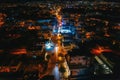 Top Down Aerial view of road at night city with cars driving, drone shot Royalty Free Stock Photo