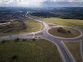 Top down aerial view of a traffic roundabout on a main road