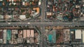 Top down cars drive at cross freeway in aerial view. Highway traffic transportation at Manila city