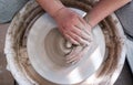 Top-down close up of a person working on pottery wheel. Royalty Free Stock Photo