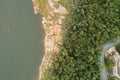 Top down of Dam lake mountains with forest green pattern beautiful sunny day summer weather Drone shot aerial view clouds Royalty Free Stock Photo