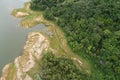 Top down of Dam lake mountains with forest green pattern beautiful sunny day summer weather Drone shot aerial view clouds Royalty Free Stock Photo