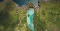 Top down of design path at azure lake on green cliff sea shore aerial view. Greenery tropical meadow Royalty Free Stock Photo