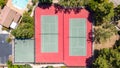 Top down drone photo of a community center in the middle of neighborhood with tennis courts, swimming pool and basketball court. Royalty Free Stock Photo