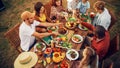 Top Down Elevated View at a Family and Friends Celebrating Outside at Home. Diverse Group of Royalty Free Stock Photo