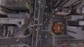 Top down footage of traffic on multilane thoroughfare in city. Main road surrounded with high rise buildings. Osaka