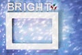 Top down perspective of white picture frame on blue painted canvas with Light decoration Royalty Free Stock Photo