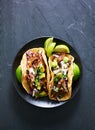 Top down phot of two mexican carnitas tacos on place in flat lay composition