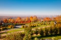 Top down photo showing beautiful fall autumn colours of park and city in fog