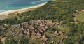 Top down of sea shore traditional village, tourist landmark. Aerial view of designed roofs houses