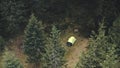 Top down tent camp at spruce forest aerial. Autumn nobody nature landscape. Fir trees at mountain Royalty Free Stock Photo