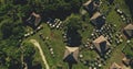 Top down of unique village with straw roofs houses at green valley aerial view. Wild tropic nature