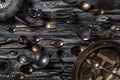 Top down view of an abstract arrangement of antique utensils and cutlery against a dark background. Royalty Free Stock Photo