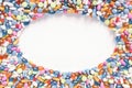 Top down view of assorted pills and tablets in an oval frame on white surface with space for text and images