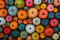A top-down view of a background filled with multicolored pumpkins, creating a vibrant pattern Royalty Free Stock Photo