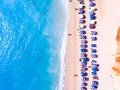 Top down view of a beach with tourists suntbeds and umbrellas wi Royalty Free Stock Photo