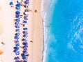 Top down view of a beach with tourists suntbeds and umbrellas wi Royalty Free Stock Photo