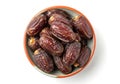 Bowl of medjool dates isolated on white background Royalty Free Stock Photo