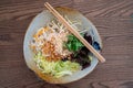 Top down view of a bowl of Vietnamese shrimp and rice noodle salad with chopsticks