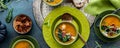 Top down view of bowls of butternut squash garnished with various toppings, ready for eating. Royalty Free Stock Photo