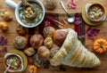 Top down view of bowls of turkey soup with a bread cornucopia filled with rolls. Royalty Free Stock Photo