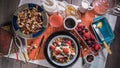 Top down view of a breakfast of yogurt, cereals, berries and dry fruits