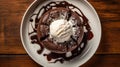 Top down view of Chocolate lava cake with a scoop of vanilla ice cream on top, served with berries on a white plate, drizzled with Royalty Free Stock Photo