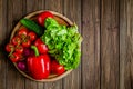 Top down view of close-up still life of fresh vegetables and herbs on wooden table, free space Royalty Free Stock Photo