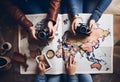 Top-Down View: Coffee, Hat, and Passport on Wood